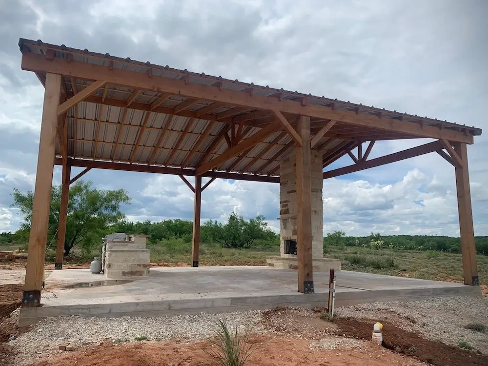 Outdoor living area with fireplace and seating